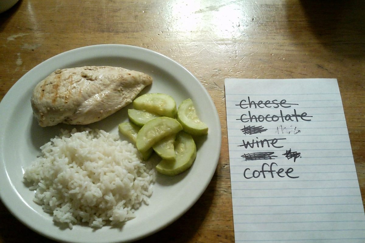 A plain elimination-diet dinner next to the banned-foods list