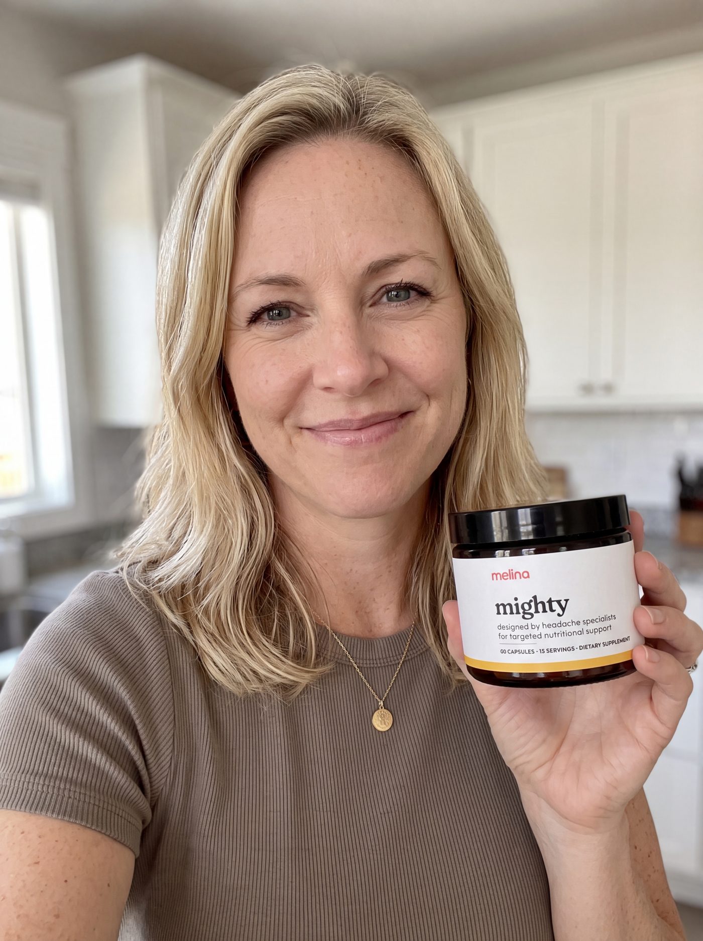 Rachel holding her jar of Mighty in the kitchen